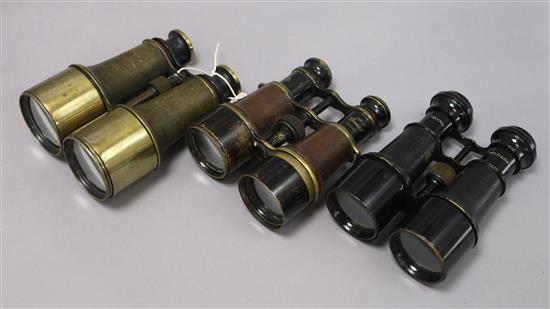 A pair of Naval military binoculars, a similar pair Mark 5 Special binoculars and another pair